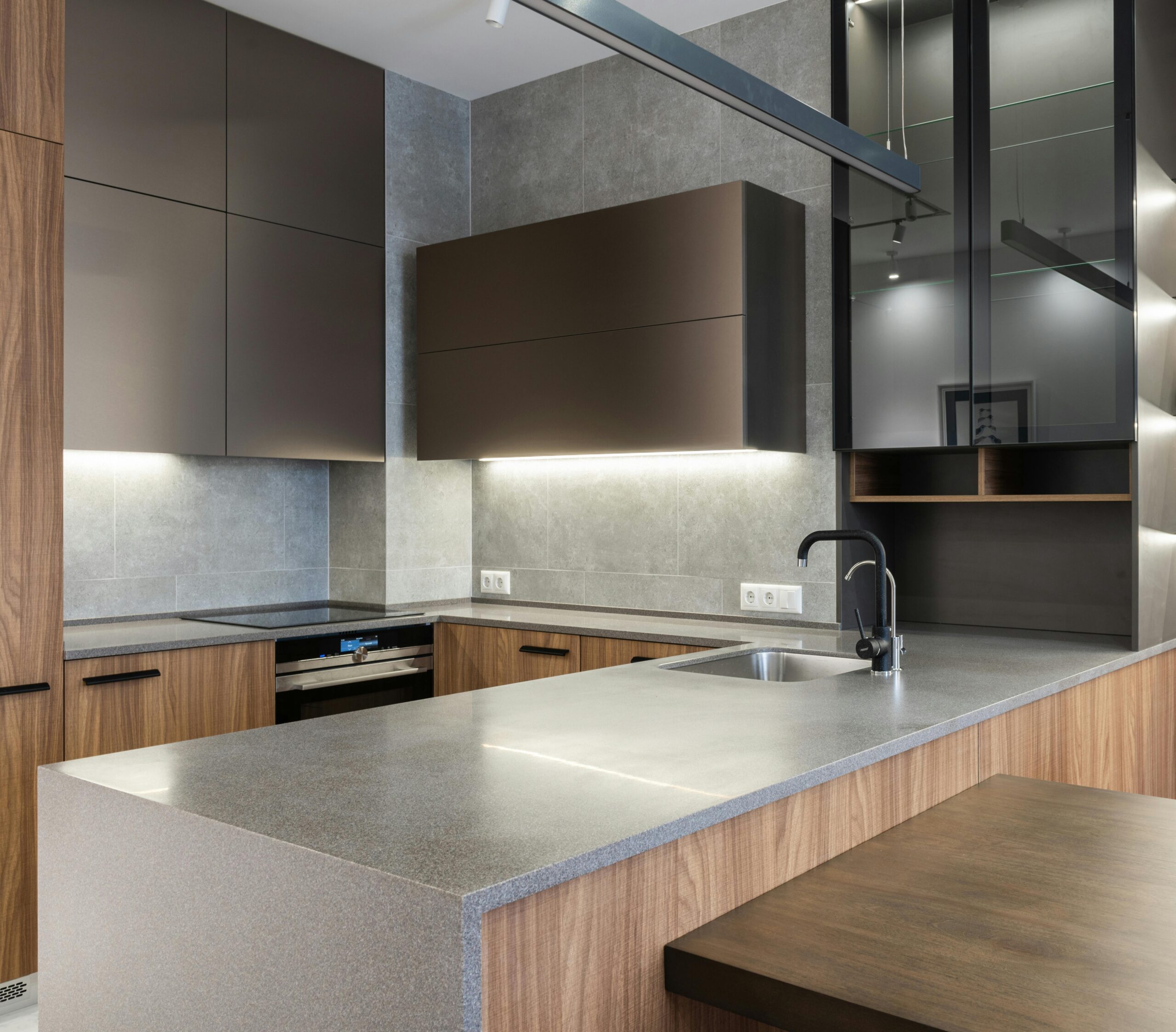 Sleek and modern kitchen with contemporary appliances and wooden cabinetry.